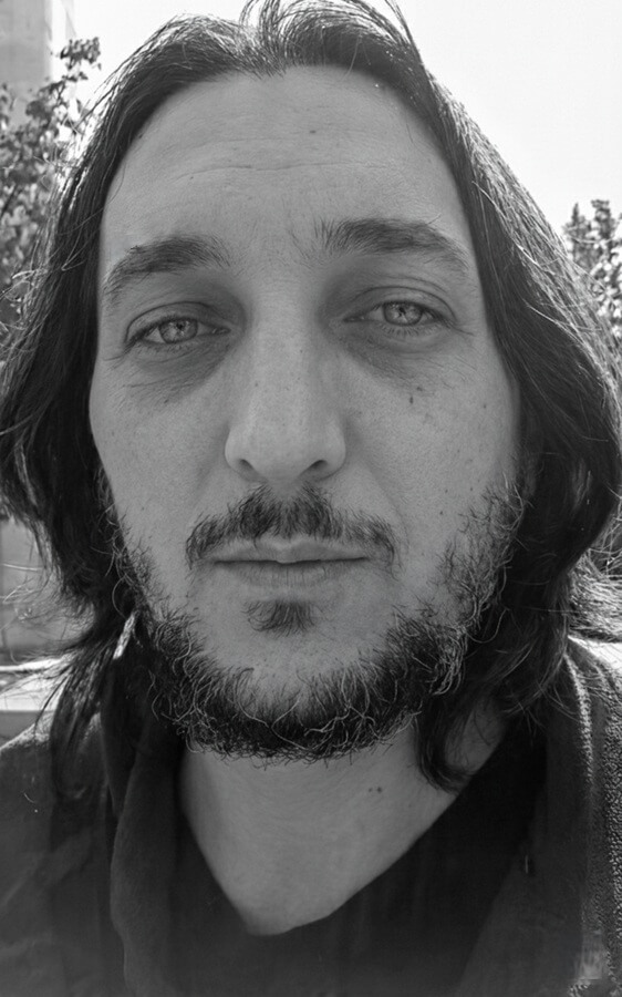 Yahya Karaogullari — Answer Engines and AI Visibility Yahya Karaogullari in a black and white portrait representing AI visibility and answer engine strategy.